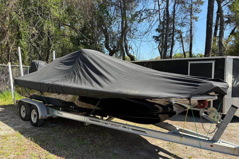 Slide: The Image of Covered 2016 Tidewater 2110 Bay Max boat on trailer, parked outdoors. - 34