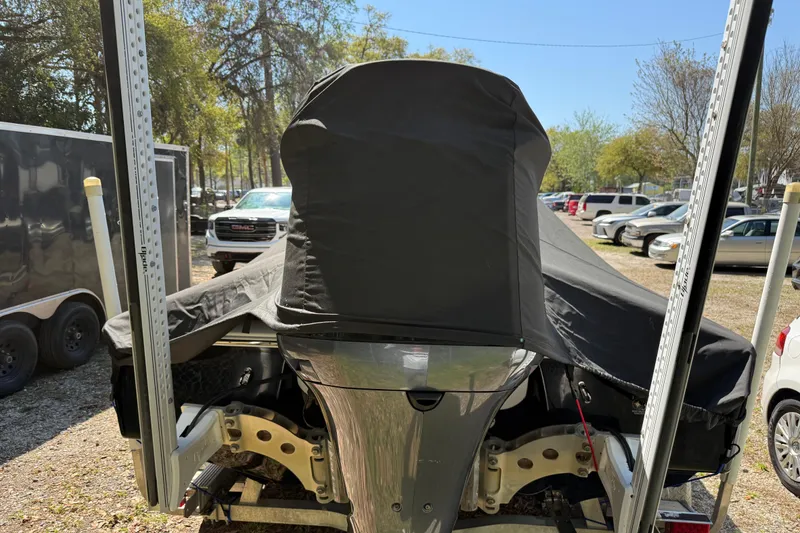 Slide: The Image of 2016 Tidewater 2110 Bay Max boat covered and parked outdoors. - 35