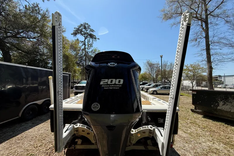 Slide: The Image of 2016 Tidewater 2110 Bay Max boat with powerful 200 horsepower engine, parked outdoors. - 5