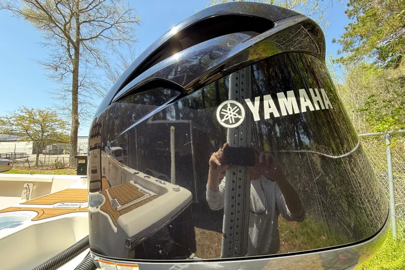 Slide: The Image of 2016 Tidewater 2110 Bay Max boat with Yamaha engine, outdoors in sunny setting. - 8