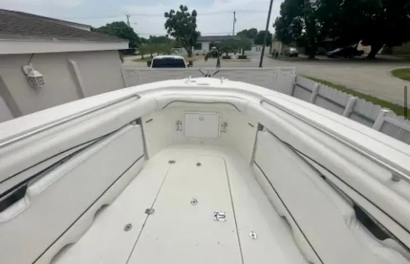 Slide: The Image of 2006 Wellcraft 32 CCF boat interior, featuring spacious seating and storage compartments. - 14