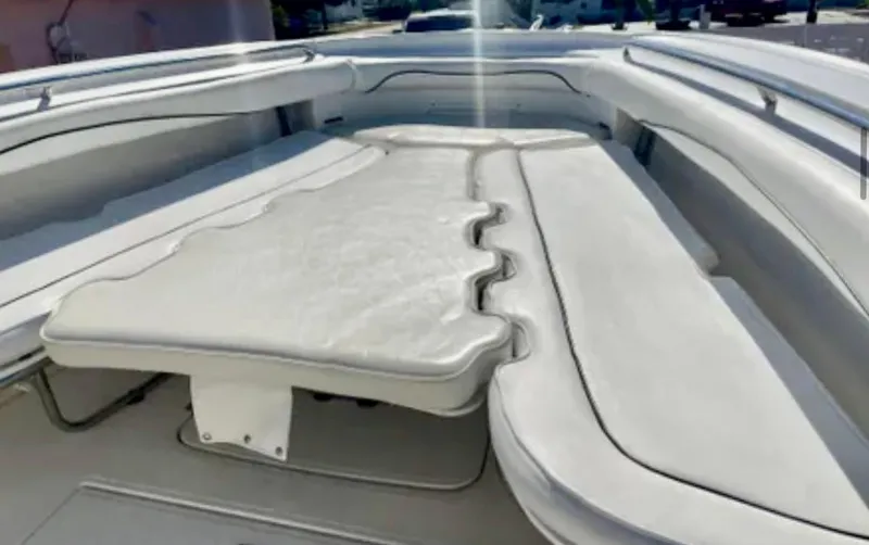 Slide: The Image of 2006 Wellcraft 32 CCF boat interior with cushioned seating and sleek design. - 16