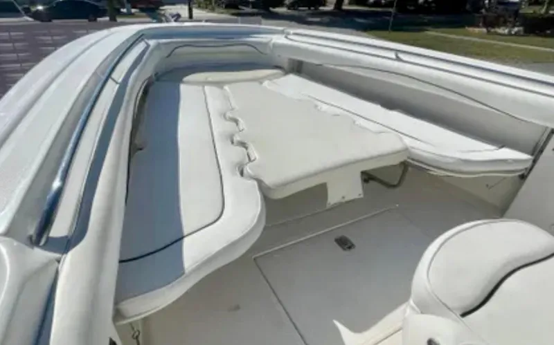 Slide: The Image of 2006 Wellcraft 32 CCF boat interior with white cushioned seating and spacious layout. - 19