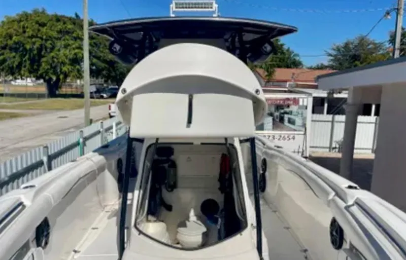 Slide: The Image of 2006 Wellcraft 32 CCF boat with open cabin and visible interior features. - 44