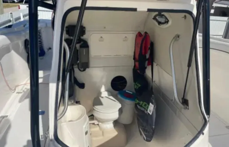 Slide: The Image of Interior of a 2006 Wellcraft 32 CCF boat showing a compact bathroom area. - 45