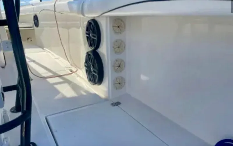 Slide: The Image of 2006 Wellcraft 32 CCF boat interior with speakers and storage compartments. - 49