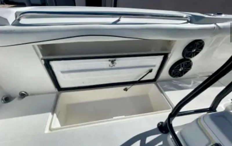 Slide: The Image of 2006 Wellcraft 32 CCF boat interior with storage compartment and speakers. - 50