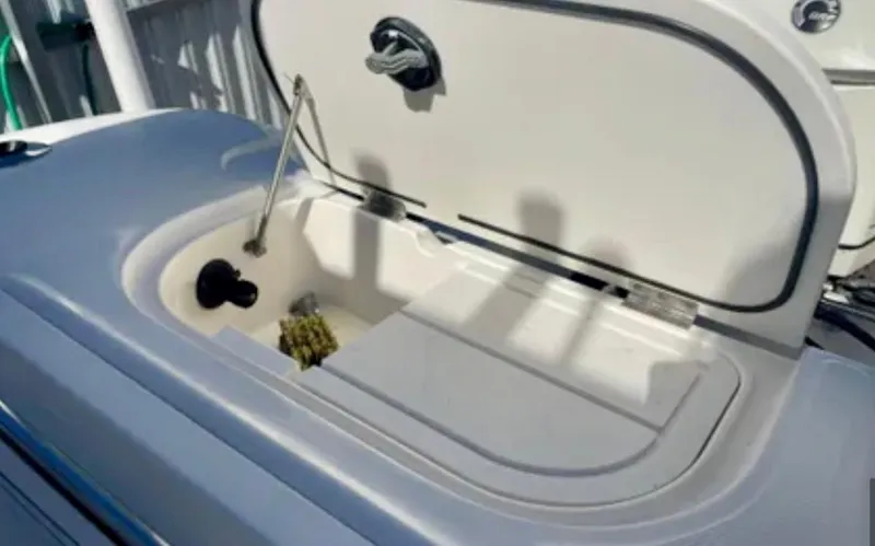 Slide: The Image of Open storage compartment on 2006 Wellcraft 32 CCF boat, showing interior details. - 51