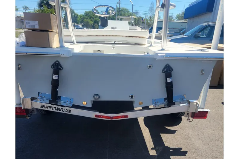 Slide: The Image of 2026 Mitzi Skiffs 17 Tournament boat on trailer, rear view in outdoor setting. - 2