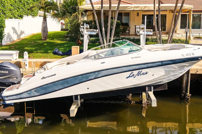 The Image of 2017 Hurricane SunDeck 2690 OB boat docked near a waterfront home. - 0