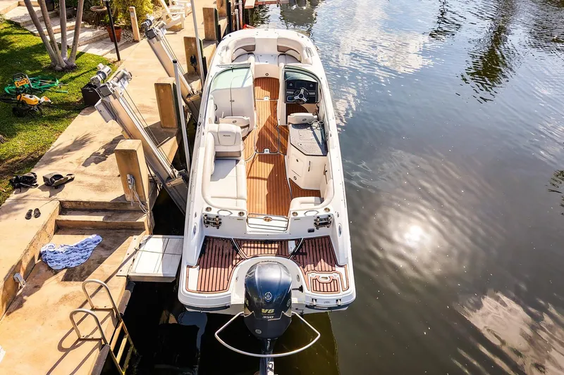 Slide: The Image of 2017 Hurricane SunDeck 2690 OB boat docked on calm water, aerial view. - 24