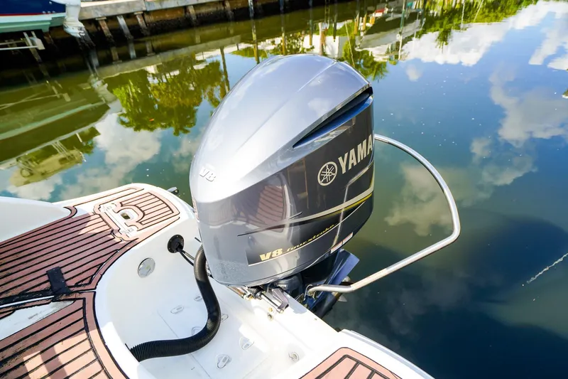 Slide: The Image of 2017 Hurricane SunDeck 2690 OB with Yamaha V8 engine on calm water. - 4