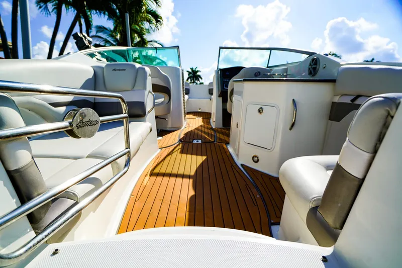 Slide: The Image of 2017 Hurricane SunDeck 2690 OB boat interior with luxurious seating and sleek design. - 6