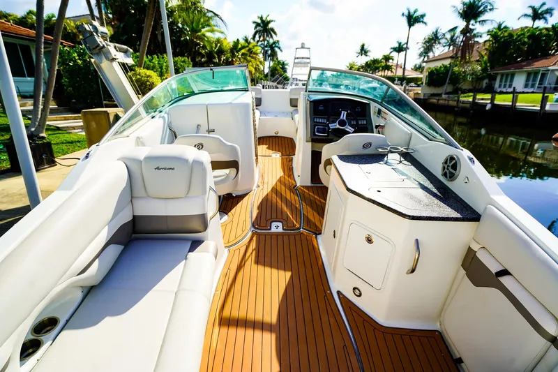 Slide: The Image of 2017 Hurricane SunDeck 2690 OB boat interior with seating, helm, and kitchenette. - 7