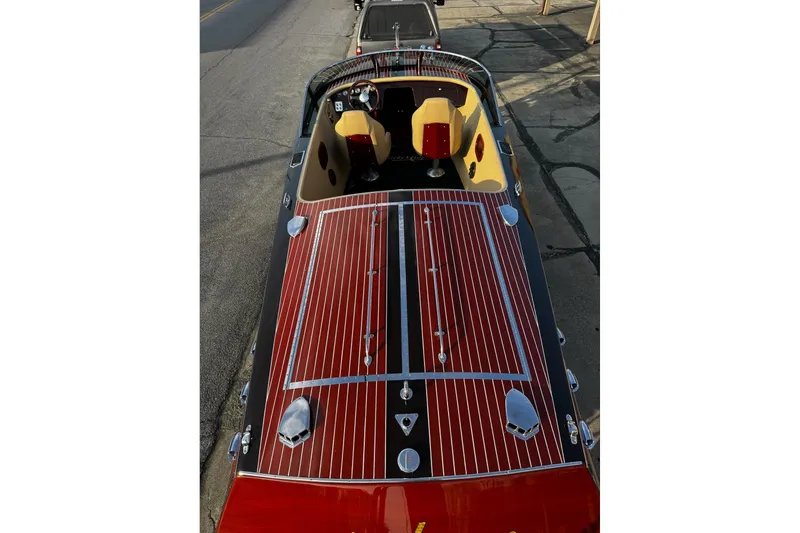 Slide: The Image of 2019 Hacker-Craft 23 Runabout with polished wood finish and sleek design. - 13