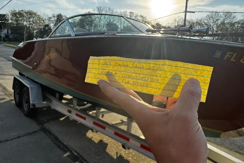 Slide: The Image of 2019 Hacker-Craft 23 Runabout on trailer, with handwritten note in foreground. - 18
