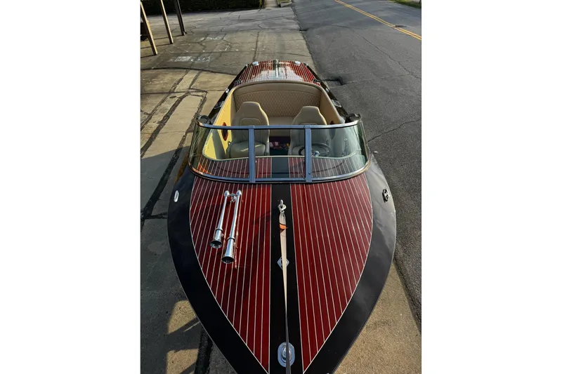 Slide: The Image of 2019 Hacker-Craft 23 Runabout boat with sleek wooden deck and classic design. - 22