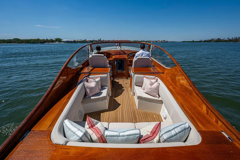 Slide: The Image of Luxurious 2017 Hinckley Talaria 34R yacht interior with elegant seating and scenic water view. - 10