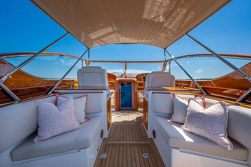 Slide: The Image of 2017 Hinckley Talaria 34R yacht interior with seating and wooden accents. - 14