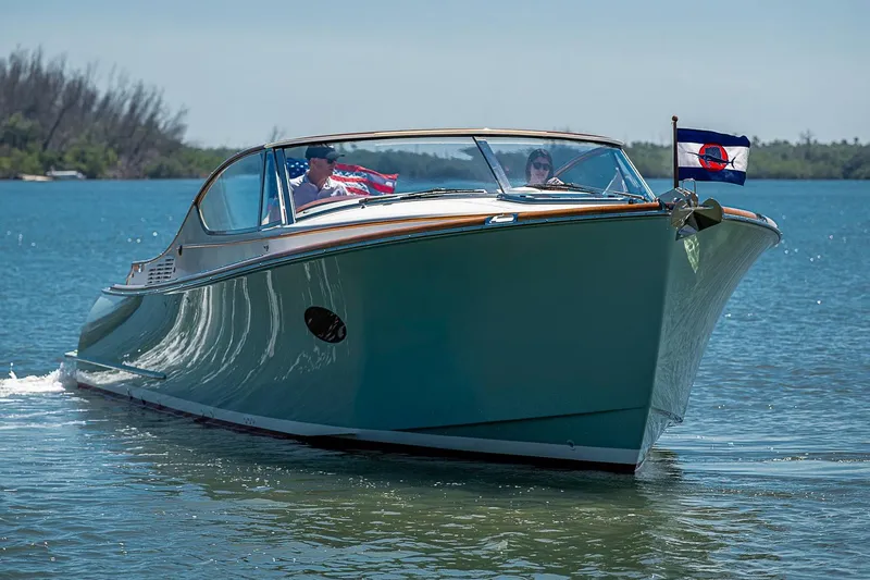Slide: The Image of Hinckley Talaria 34R 2017 boat deck with American flag on open water. - 5