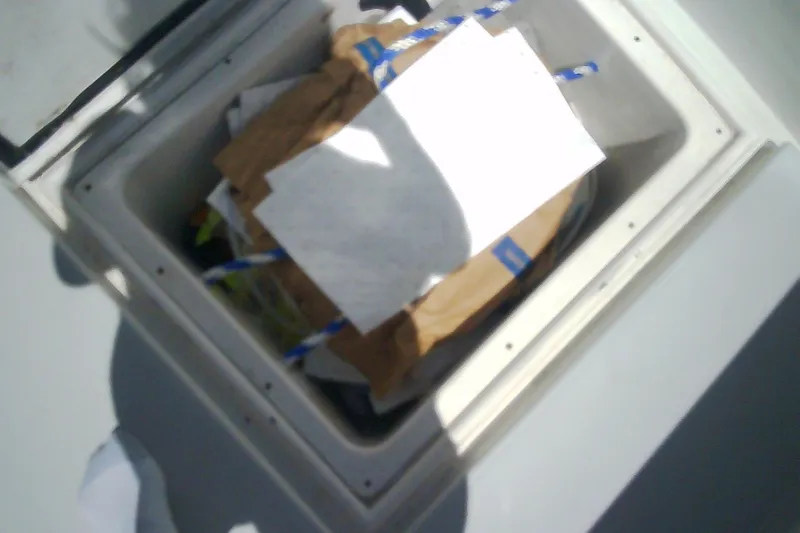 Slide: The Image of Open refrigerator inside a 1999 Sabre 34 boat, showing empty shelves. - 47