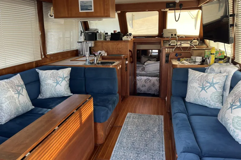 Slide: The Image of 1999 Sabreline Swift Trawler stern view with propellers and rudders visible. - 87