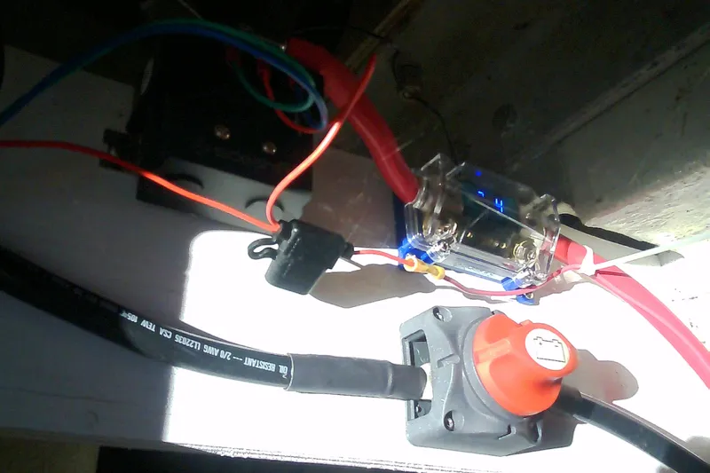 Slide: The Image of Electrical wiring setup in a 1999 Sabre 34 boat, featuring cables and connectors. - 38