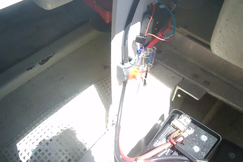 Slide: The Image of Electrical wiring setup in a 1999 Sabre 34 boat, featuring battery connections and components. - 39