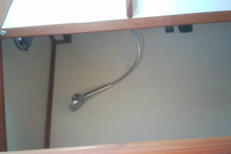 Slide: The Image of Interior view of a 1999 Sabre 34 yacht showing a showerhead fixture. - 57