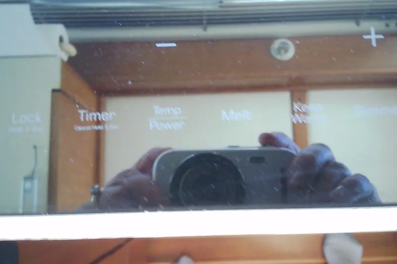 Slide: The Image of Reflection on a Sabre 34 boat's control panel, showing various settings and buttons. - 71
