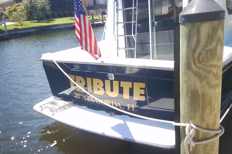 Slide: The Image of 1999 Sabre 34 boat named "Tribute" docked in Punta Gorda, Florida. - 8