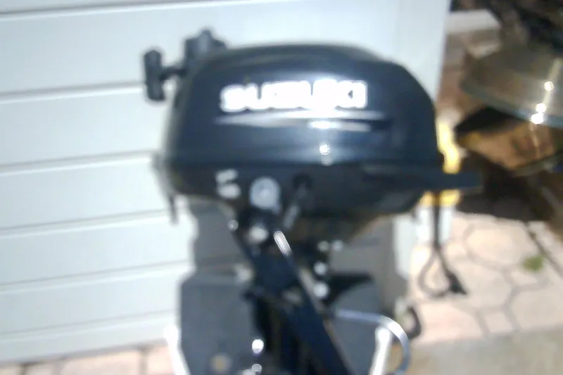 Slide: The Image of Blurred image of a Suzuki outboard motor, Sabre 34, 1999 model. - 83