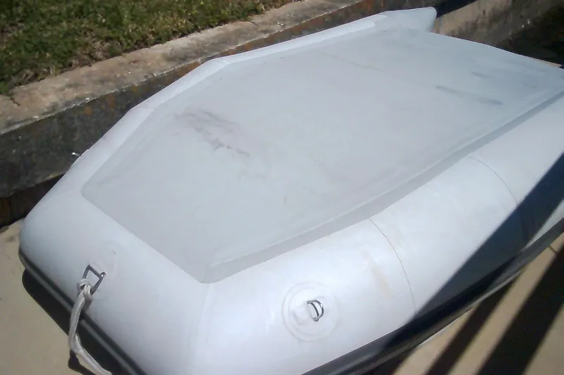 Slide: The Image of Inflatable boat on concrete surface, Sabre 34 model, 1999. - 84