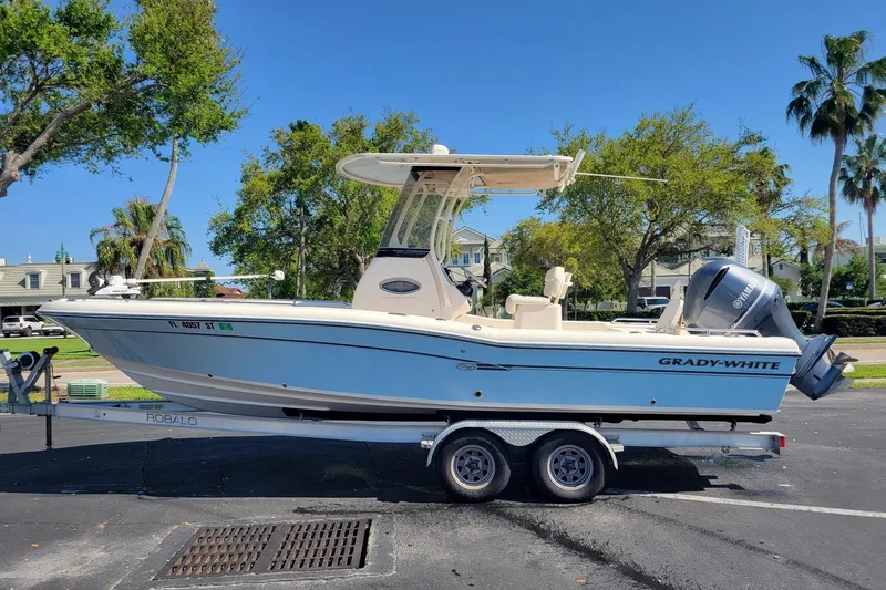 The Image of 2019 Grady-White 251 Coastal Explorer boat on trailer, parked outdoors. - 0