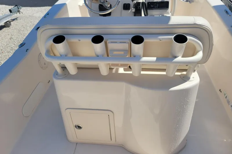 Slide: The Image of 2019 Grady-White 251 Coastal Explorer boat interior with rod holders and storage compartment. - 10