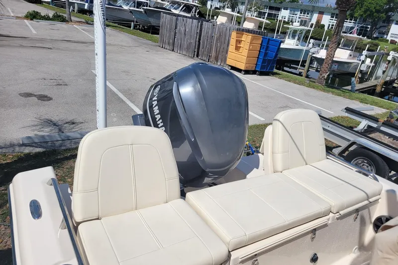 Slide: The Image of 2019 Grady-White 251 Coastal Explorer boat with Yamaha engine, parked at marina. - 12