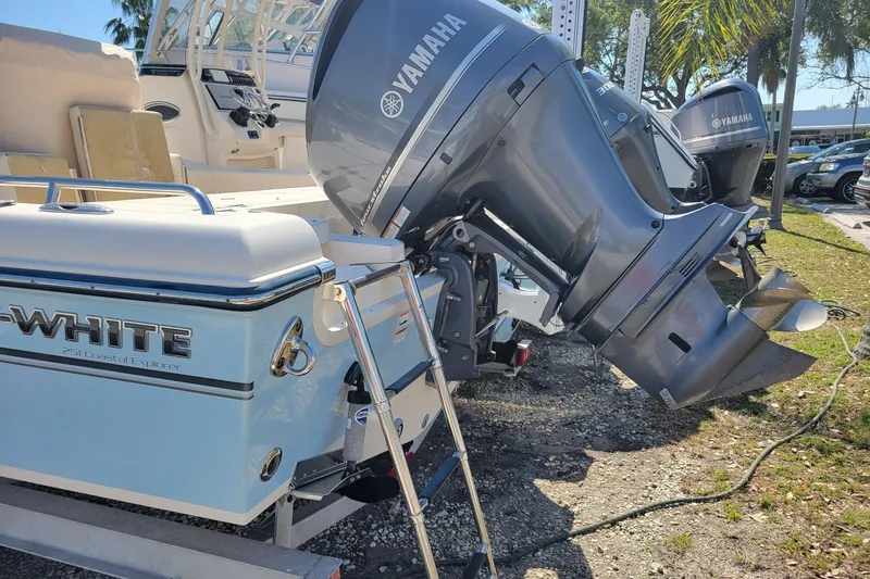 Slide: The Image of 2019 Grady-White 251 Coastal Explorer boat with Yamaha outboard engines, parked outdoors. - 17