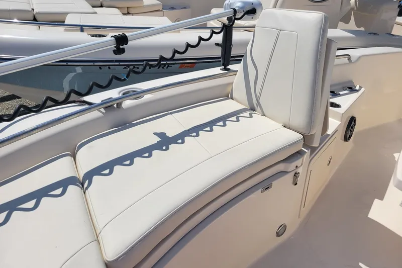 Slide: The Image of 2019 Grady-White 251 Coastal Explorer boat interior with cushioned seating and sleek design. - 8