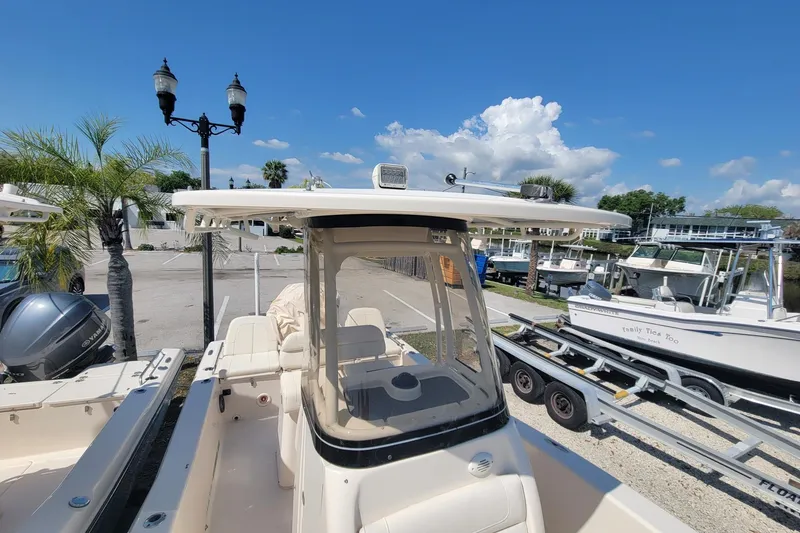 Slide: The Image of 2019 Grady-White 251 Coastal Explorer boat docked under clear blue sky. - 9