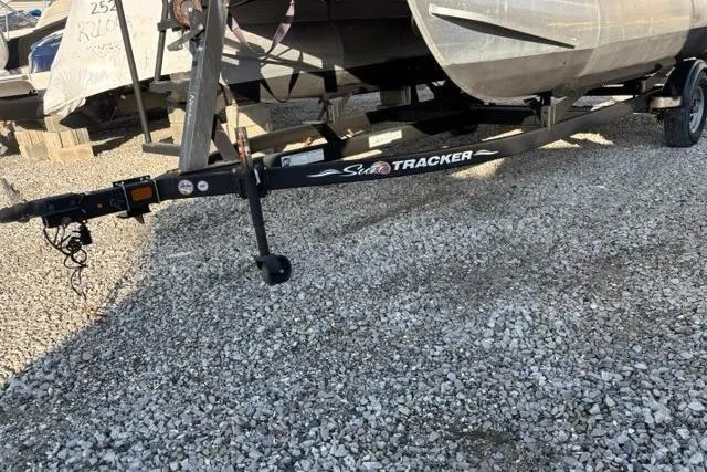 Slide: The Image of Sun Tracker Bass Buggy 16 XL 2022 on trailer, gravel ground. - 20