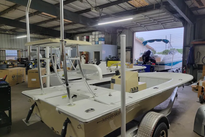 The Image of 2026 Mitzi Skiffs 17 Tournament boat in a workshop, showcasing sleek design and modern features. - 0