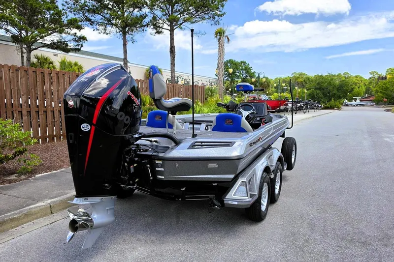 Slide: The Image of 2026 Ranger Z518 Cup-Equipped boat with powerful engine, parked on a sunny street. - 3