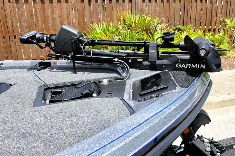 Slide: The Image of 2026 Ranger Z518 Cup-Equipped boat with Garmin trolling motor, parked outdoors. - 16