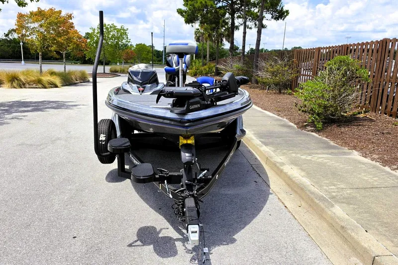 Slide: The Image of 2026 Ranger Z518 Cup-Equipped boat parked on a sunny street. - 11
