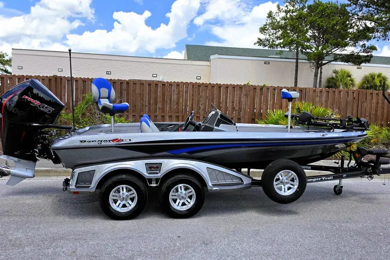 The Image of 2026 Ranger Z518 Cup-Equipped boat on trailer, parked outdoors. - 0