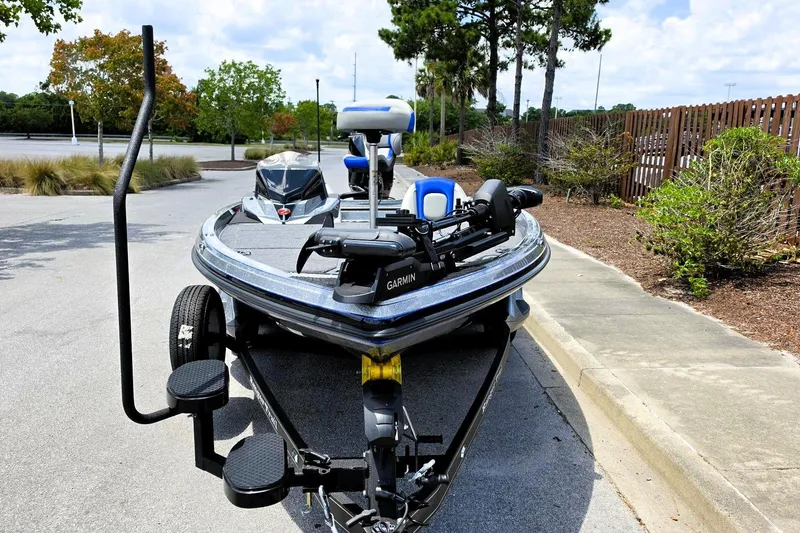 Slide: The Image of 2026 Ranger Z518 Cup-Equipped boat on trailer, parked outdoors, featuring Garmin equipment. - 10
