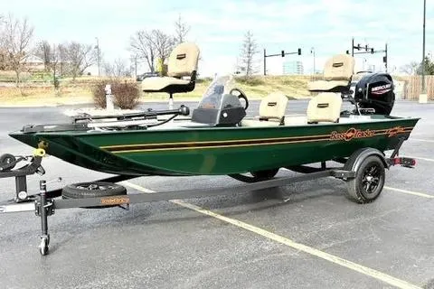 Slide: The Image of 2026 Tracker Bass Tracker Classic Limited fishing boat on trailer in parking lot. - 59