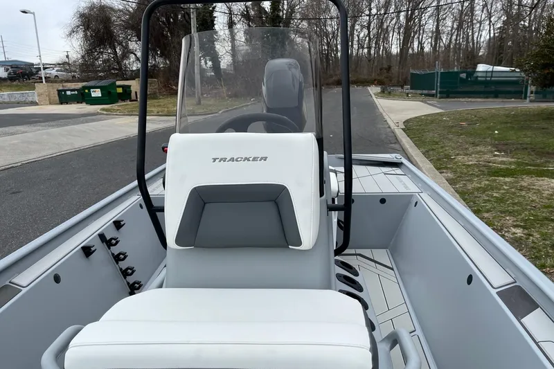 Slide: The Image of 2026 Tracker Bass Tracker Classic CC boat interior with steering console and seating. - 11