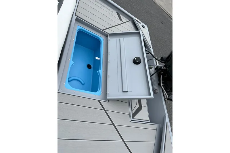 Slide: The Image of 2026 Tracker Bass Tracker Classic CC boat with open storage compartment on deck. - 9