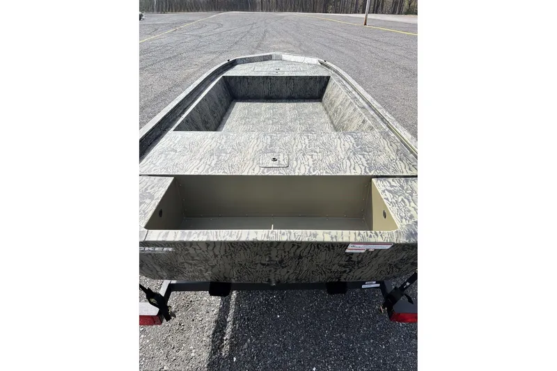 Slide: The Image of 2026 Tracker Grizzly 1648 Utility boat with camouflage design on a trailer. - 5